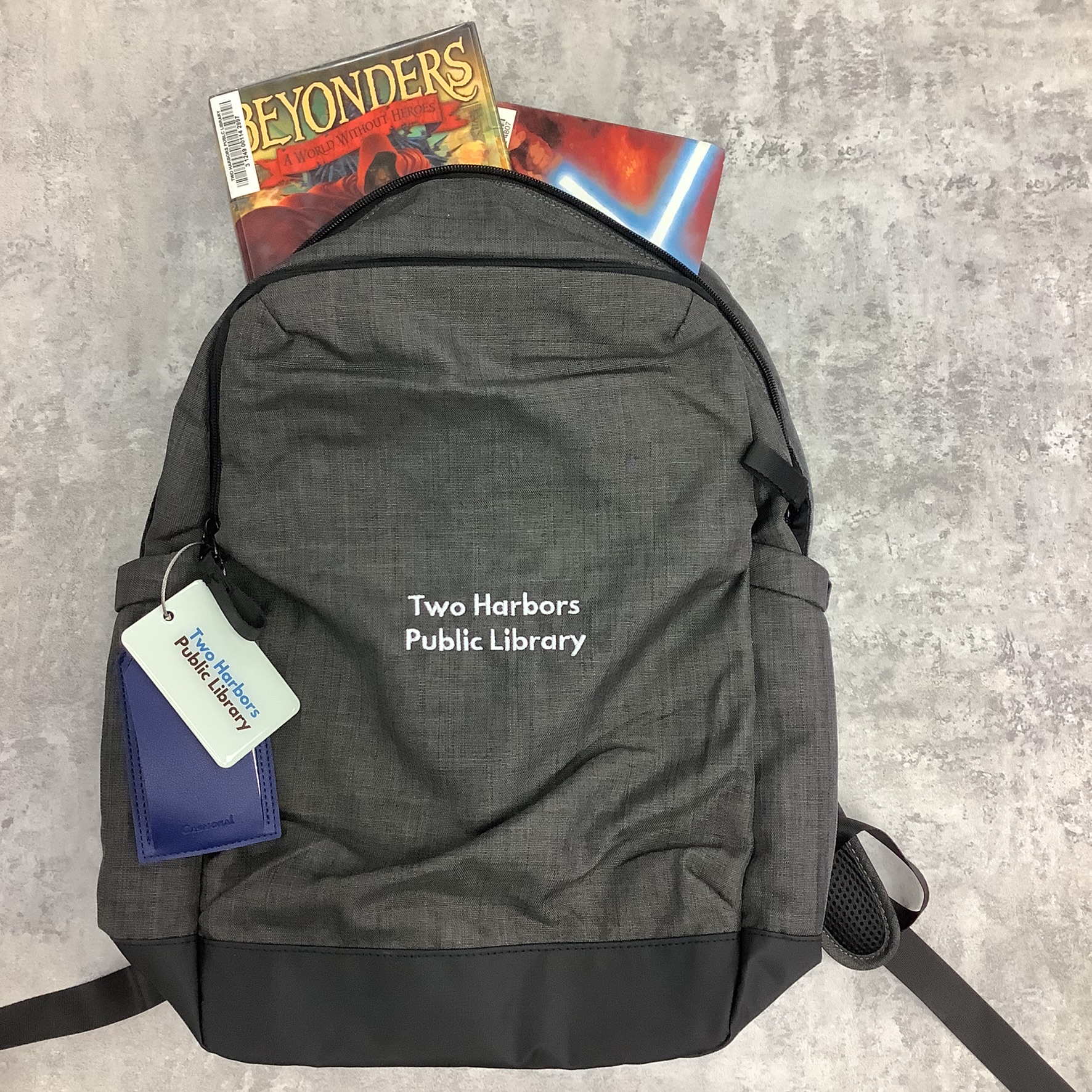 Borrowers' Backpack with two books peeking out